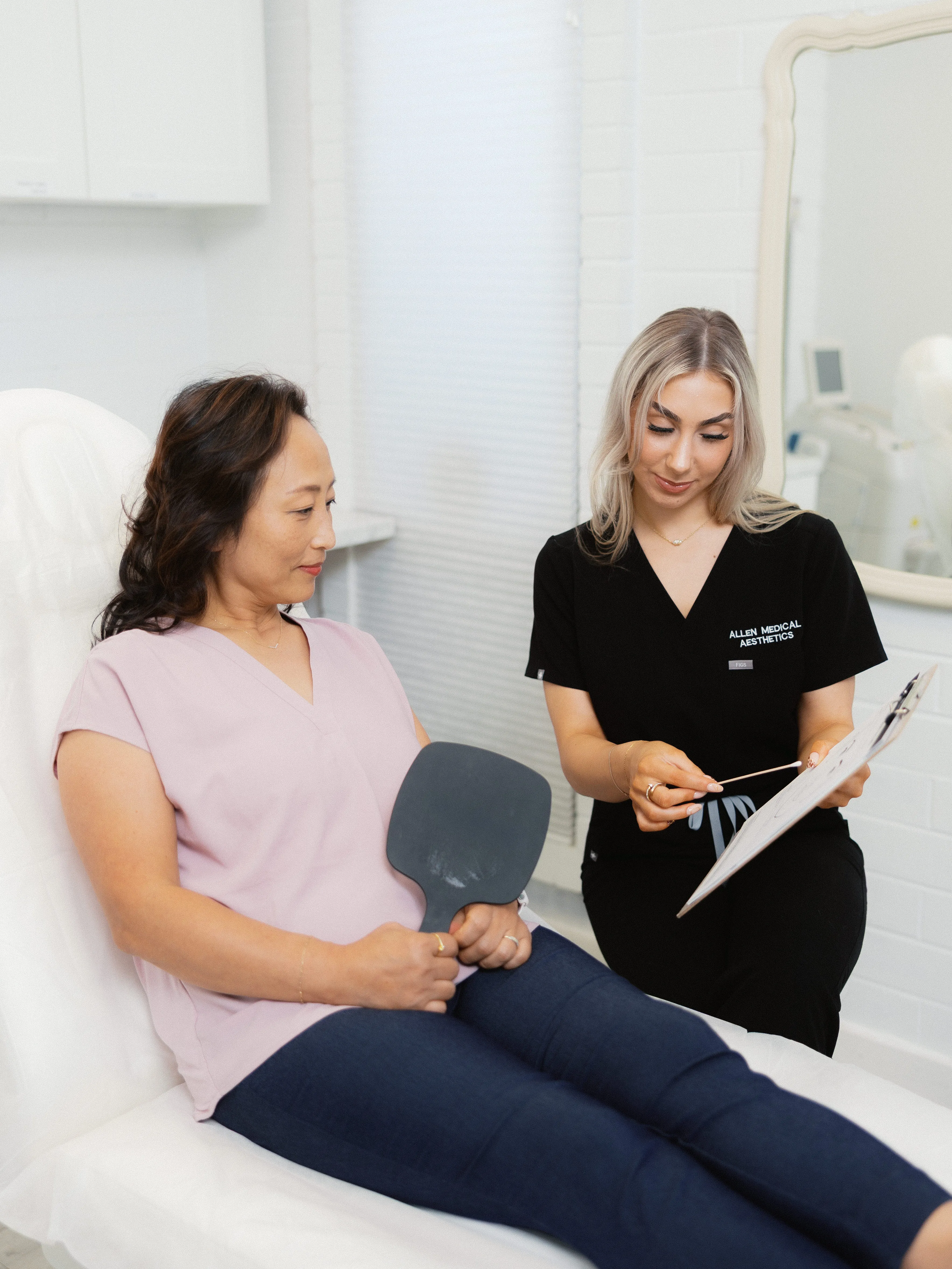 Allen Medical Aesthetics provider reviewing a treatment plan with a patient during a consultation
